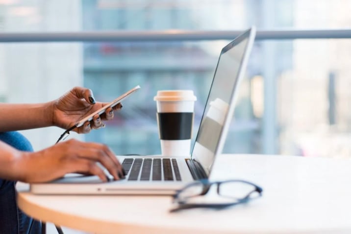 Person using macbook air on table